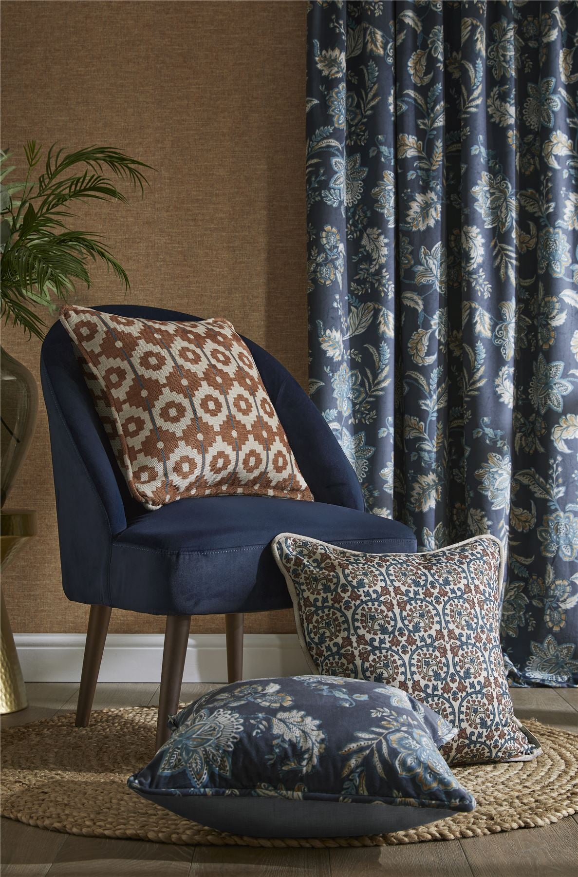 Global Treasures jewel-toned botanical wallpaper behind a wooden sideboard